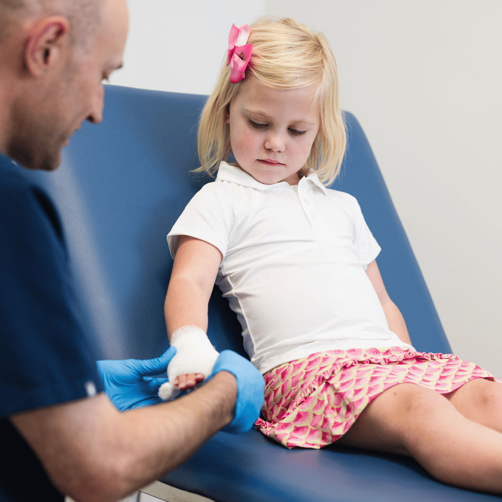 SmartMED Provider Talking to Child and Delivering Drive-Thru Pediatric Urgent Care in North Atlanta
