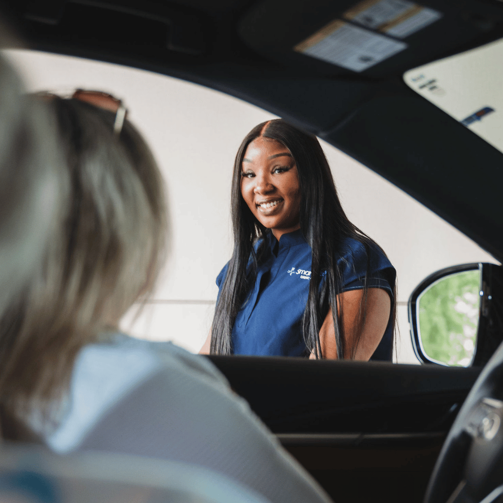 SmartMED Provider Talking to Patient and Delivering Drive-Thru Urgent Care in North Atlanta