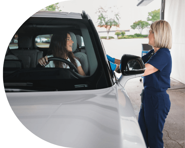 Patient Pulling Into SmartMED Drive-Thru Urgent Care for Rapid Flu and COVID Testing